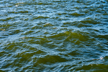 Waving clear blue sea water as a natural background.