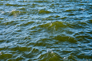 Waving clear blue sea water as a natural background.