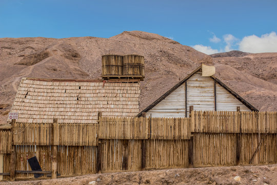 American wild west wooden buildings decoration in dry desert outdoor scenic landscape environment, historical architecture, cinema object and travel sightseeing site concept place photography