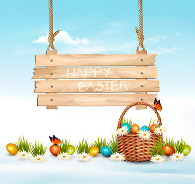 Easter Holiday Background with colofrul eggs in green grass and wooden sign. Vector.