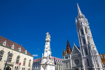 Fototapeta na wymiar Matthias Church and the Statue of the Holy Trinity at the heart of Buda Castle District
