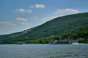 ferry floats on the river against the backdrop of the village