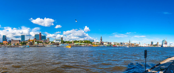 Panoramic sunny view of Hamburg harbour and Elbe river, Germany. Port of Hamburg and Building of Elbphilharmonie on the background