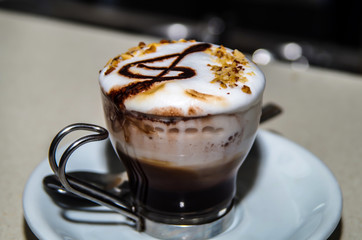Cup of cappuccino photographed at close range to emphasize the design
