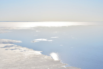 Melting ice on the sea at sunny day.