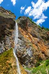 Fototapeta na wymiar Rinka Falls is a waterfall in the Logar Valley, northern Slovenia