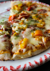  Pizza with vegetables close-up. Photo taken in yellow and white.