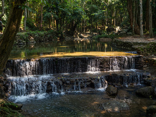 Fototapeta premium Water flows over the rocks of the waterfall on Koh Phangan. Thailand