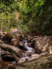 Water flows over the rocks of the waterfall on Koh Phangan. Thailand