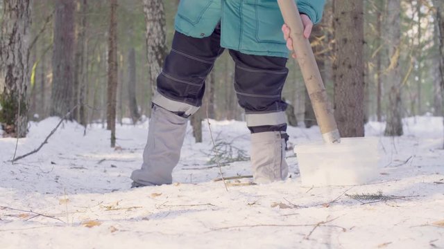 Close up. Ecologist getting samples of snow in the winter forest