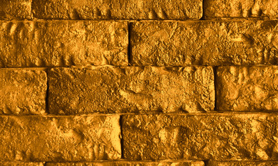 Gold Brick wall texture or brick wall background.