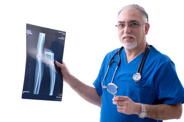 White bearded old doctor radiologist working in clinic 