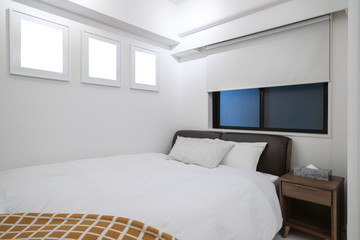 Interior of Small bedroom with queen size bed