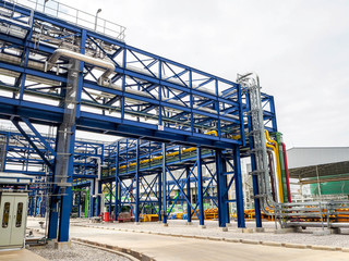 Steam pipe line and blue pipe rack in power plant.
