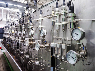 Temperature gauge for measuring instrument close up in industry zone at power plant.