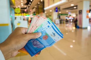 Malaysia money ringgit bill in hand