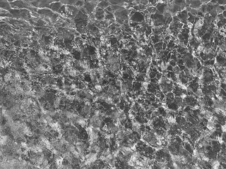 Fondo y textura del reflejo del sol sobre piscina