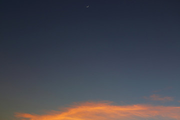 evening clear blue sky with orange sunlight shine through cloud