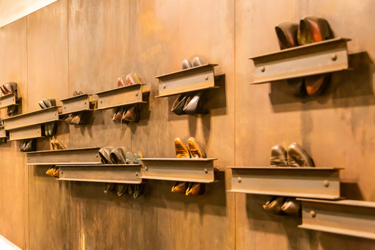Abstract composition of vintage shoes attached to the wall in Earth Passage