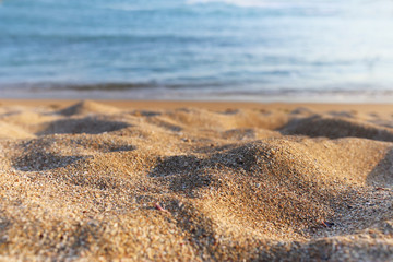 background image of sandy beach and ocean waves