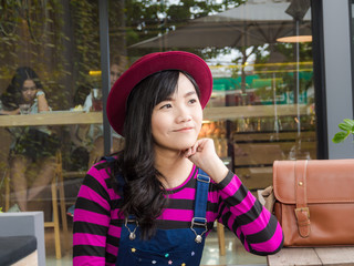 Fashion asian cute women with leather handmade bag in cafe