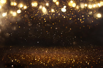 Obraz na płótnie Canvas glitter vintage lights background. black and gold. de-focused