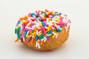 donut with sprinkles on white background