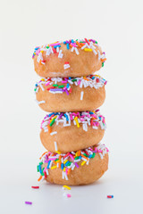 stack of sprinkled doughnuts