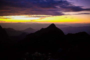 Silhouette sunset on mountain with colorful sky cloud