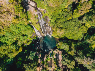 Aerial view of waterfall with clear water in jungle, Bali