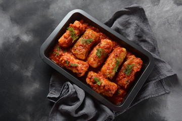 Cabbage rolls with chicken meat and rice in tomato sauce. Stuffed cabbage leaves. Delicious dinner 