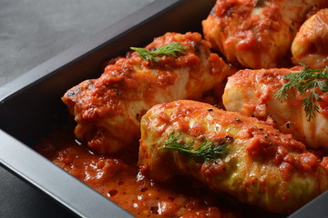 Cabbage rolls with chicken meat and rice in tomato sauce. Stuffed cabbage leaves. Delicious dinner 