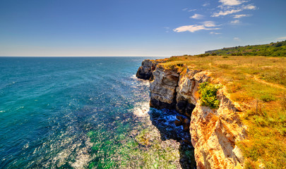 Beautiful landscape with rocky shore and blue sea