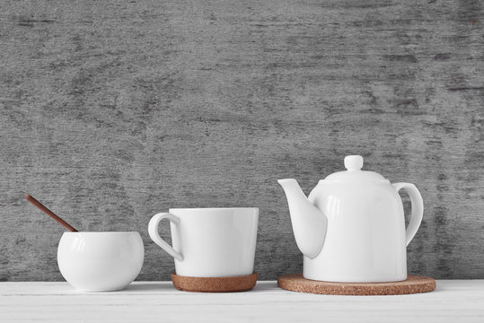 Cup of tea, teapot and sugar bowl