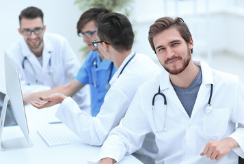 smiling doctor on the background of the medical offic
