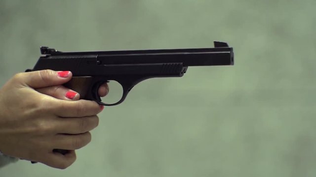 Slow Motion - Detail of a firing pistol