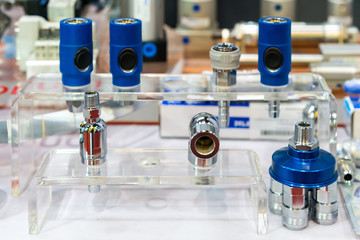 many kind of metal quick coupling or fittings equipment connector for air or liquid on table