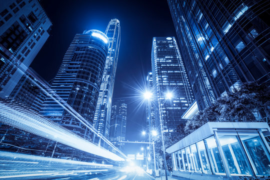 Fototapeta Urban Nightscape Architecture Street and Fuzzy Car Lights..