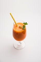 Musk melon juice with slice, also known as Kharbuj/kharbuja fruit extract, served in a glass with mint. selective focus