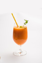 Musk melon juice with slice, also known as Kharbuj/kharbuja fruit extract, served in a glass with mint. selective focus