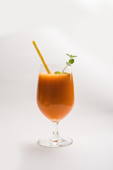 Musk melon juice with slice, also known as Kharbuj/kharbuja fruit extract, served in a glass with mint. selective focus