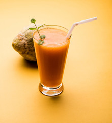 Musk melon juice with slice, also known as Kharbuj/kharbuja fruit extract, served in a glass with mint. selective focus