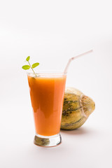 Musk melon juice with slice, also known as Kharbuj/kharbuja fruit extract, served in a glass with mint. selective focus