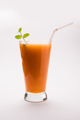 Musk melon juice with slice, also known as Kharbuj/kharbuja fruit extract, served in a glass with mint. selective focus