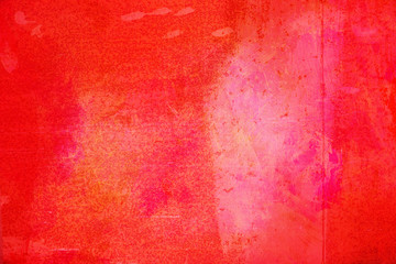 The abstract bright red surface has a brush painted on the background for graphic design. 