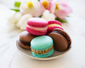 Colorful macaroons and tulips