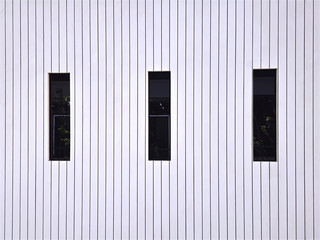 Full Frame Background of White Wooden Plank Wall with Black Tall Rectangular Windows