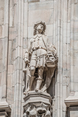 Fototapeta premium Decorative Religious figure at facade of the Cathedral of Milano, Milan, Italy