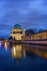 Beautiful view of illuminated Berliner Dom (Berlin Cathedral) on Museum Island and reflections on the Spree River in Berlin, Germany, at dusk. Copy space.