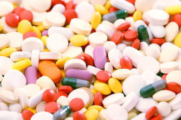 Different colorful tablets at white background